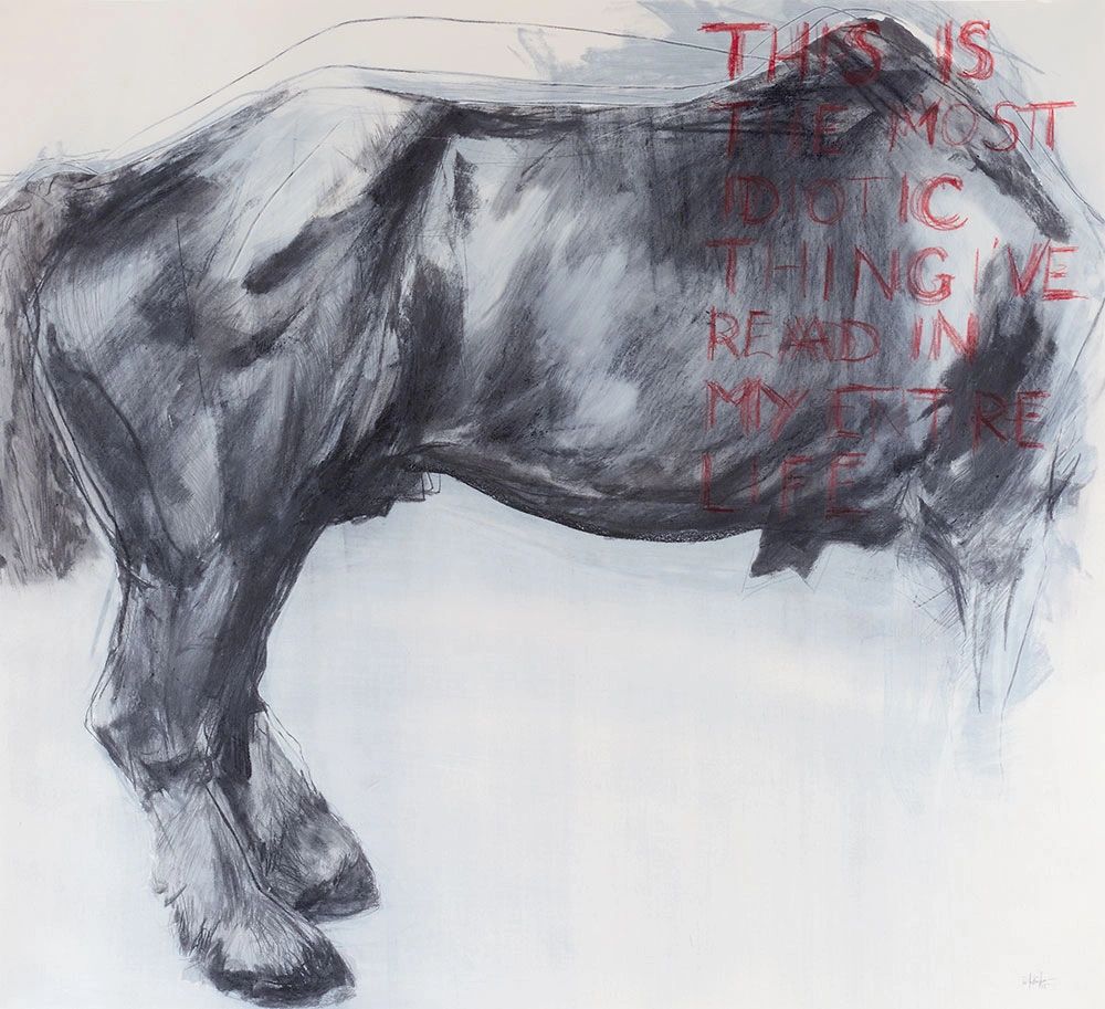 a standing, large horse with text