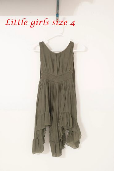 Olive green little girls dress, size 4, hanging on a white hanger.