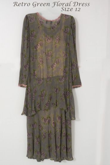 Retro green floral dress in size 12 with delicate pink and green flower patterns.