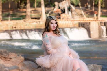 Beautiful mom posing for her maternity pictures at Hurricane shoals park