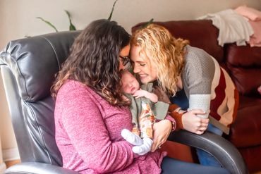 In Home Newborn session with baby girl and mommy and big sister
