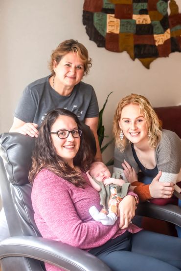In home Newborn session with mom, big sister and grandma