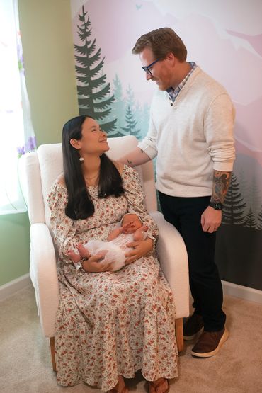 In Home Newborn session with Mom and dad in babies new room
