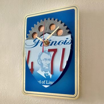 Auto Gear Wall Clock with Illinois License Plate and Shield Pennies.  Artist, Steven Shaver.