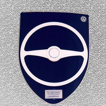VW CEO retirement gift - Shield with vintage VW steering wheel.  Artist, Steven Shaver.