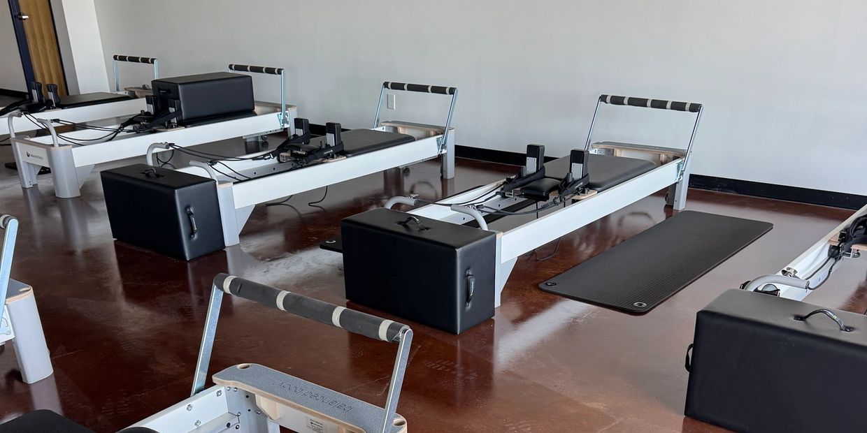 Pilates Reformer machines for group instruction.
