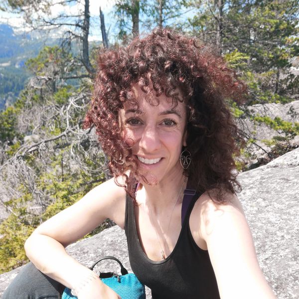 Shelley sitting on a cliff