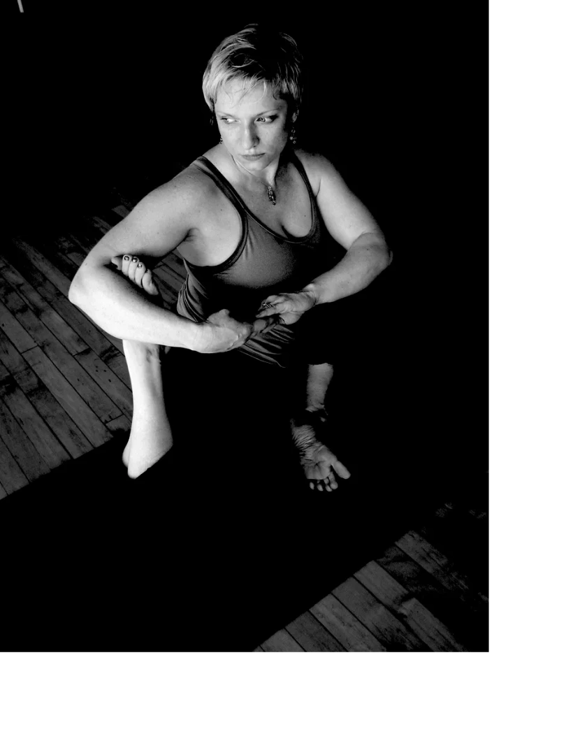 grey scale image of yoga practitioner in pigeon pose
