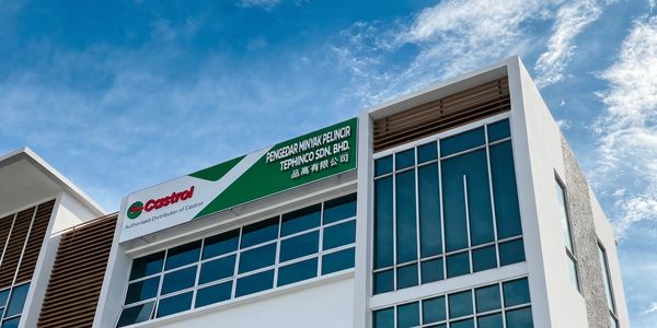 Castrol distributor building under a blue sky.