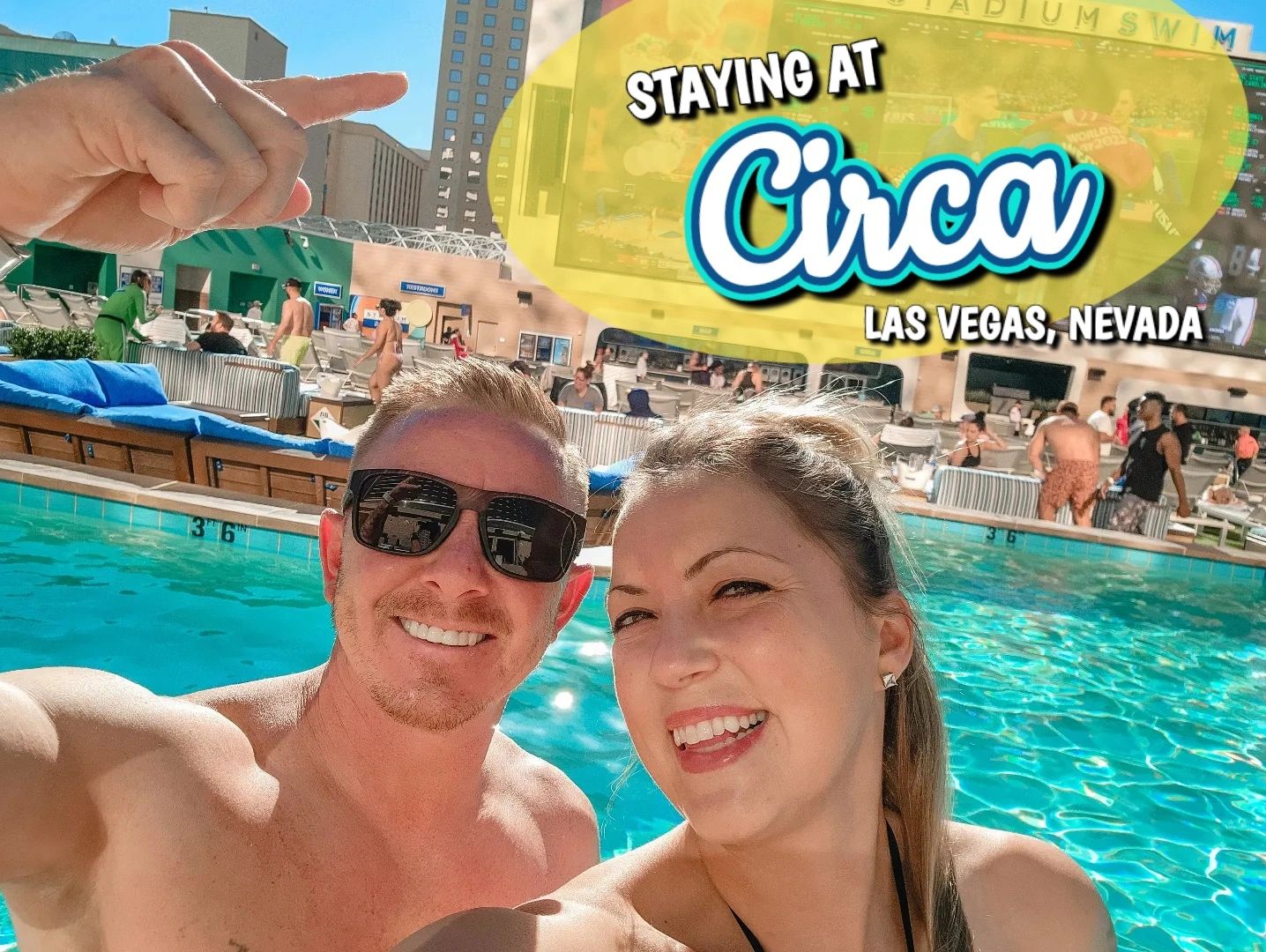 man and woman smiling while sitting in a pool at Circa Las Vegas