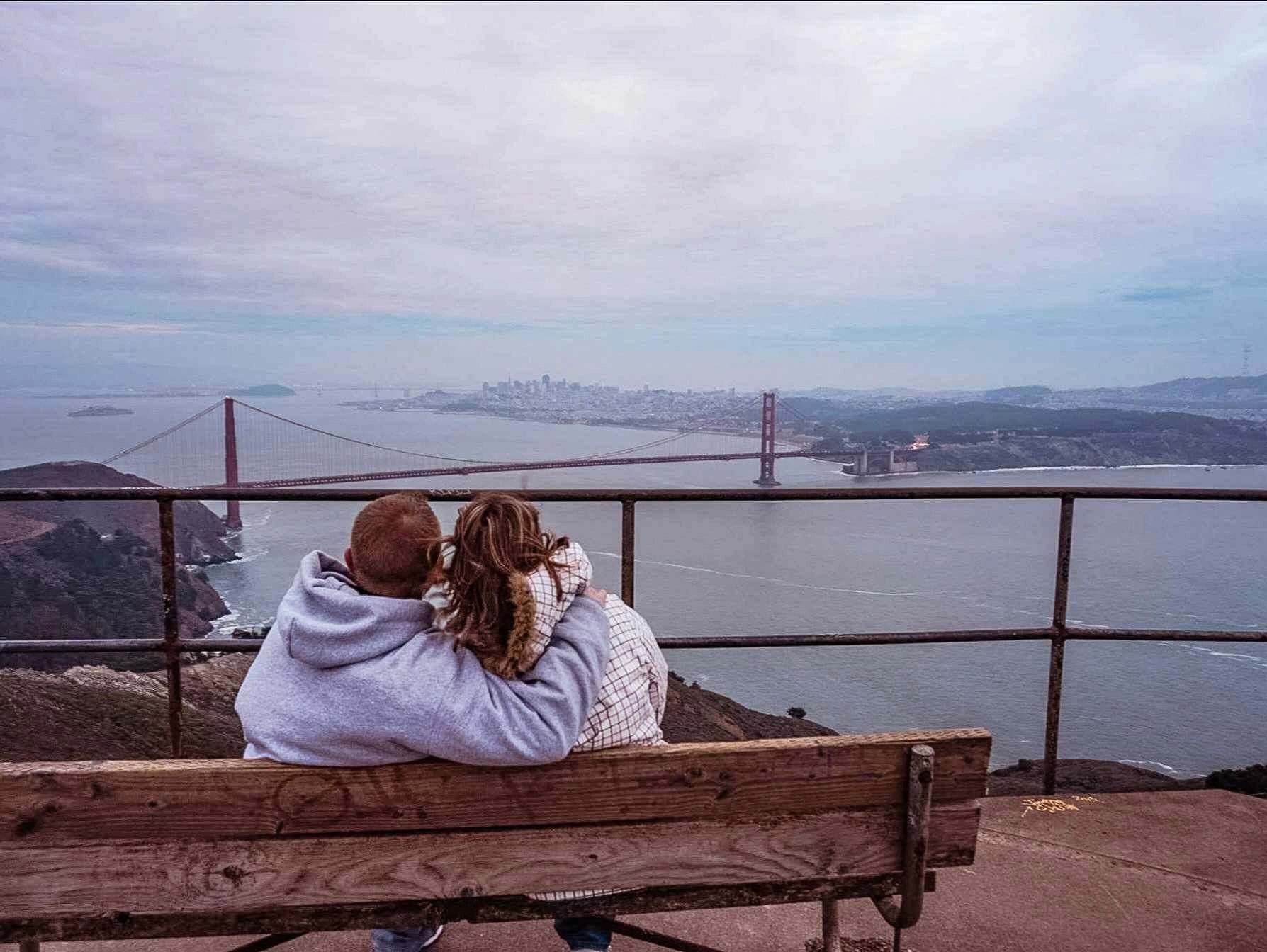 man and woman overlooking the Golden Gate Bridge in San Francisco