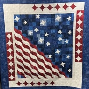 Red, white and blue quilt.