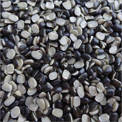 Close-up of black and white split beans scattered closely together.