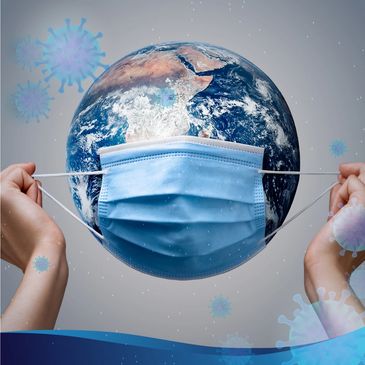 Hands putting mask on the globe