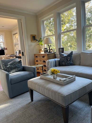 Family room sofa, side chair and upholstered ottoman