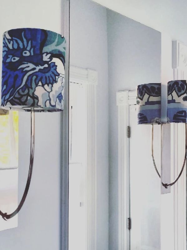 Sconces in bathroom with custom shades