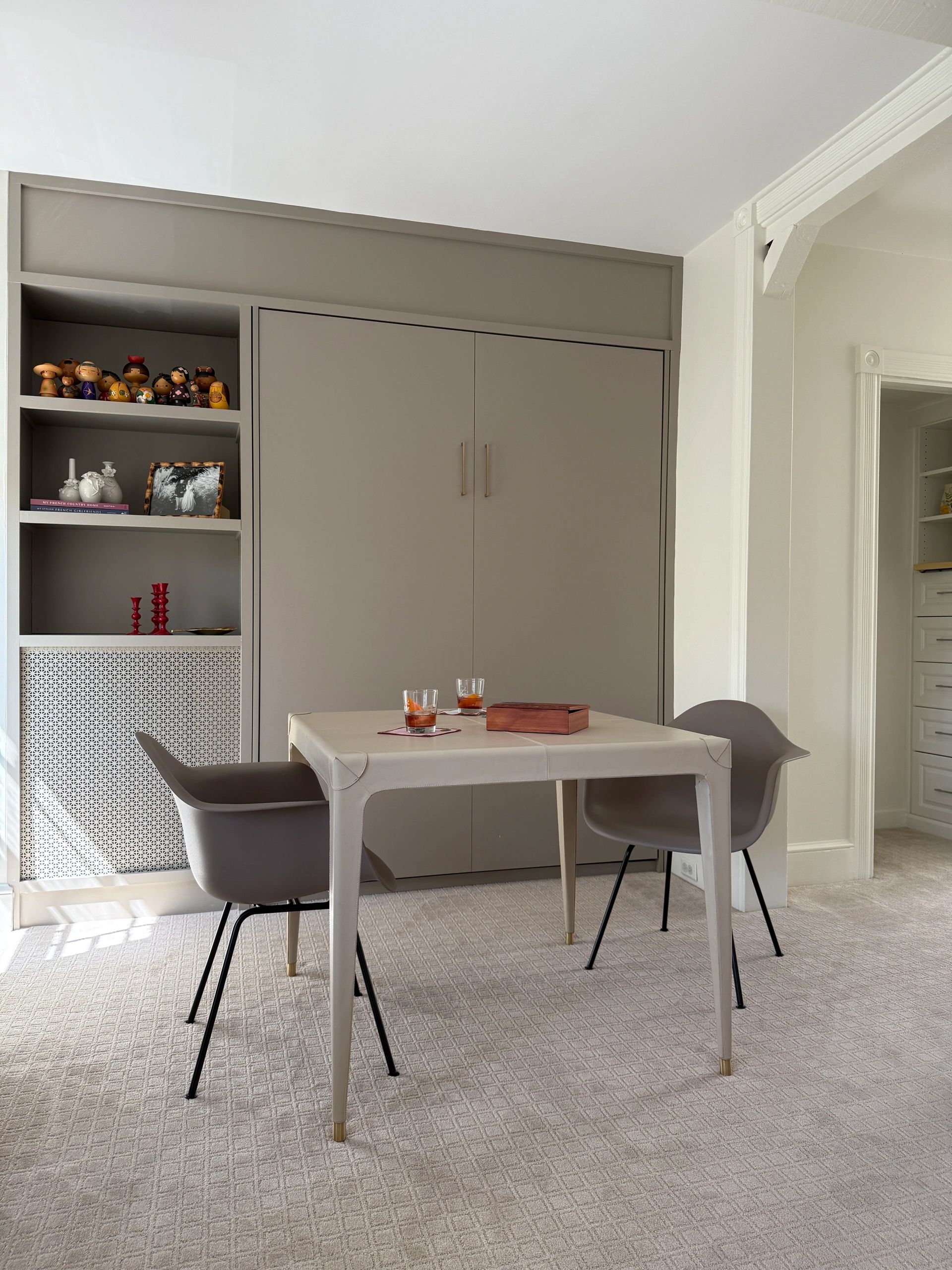Leather game table in front of Murphy bed