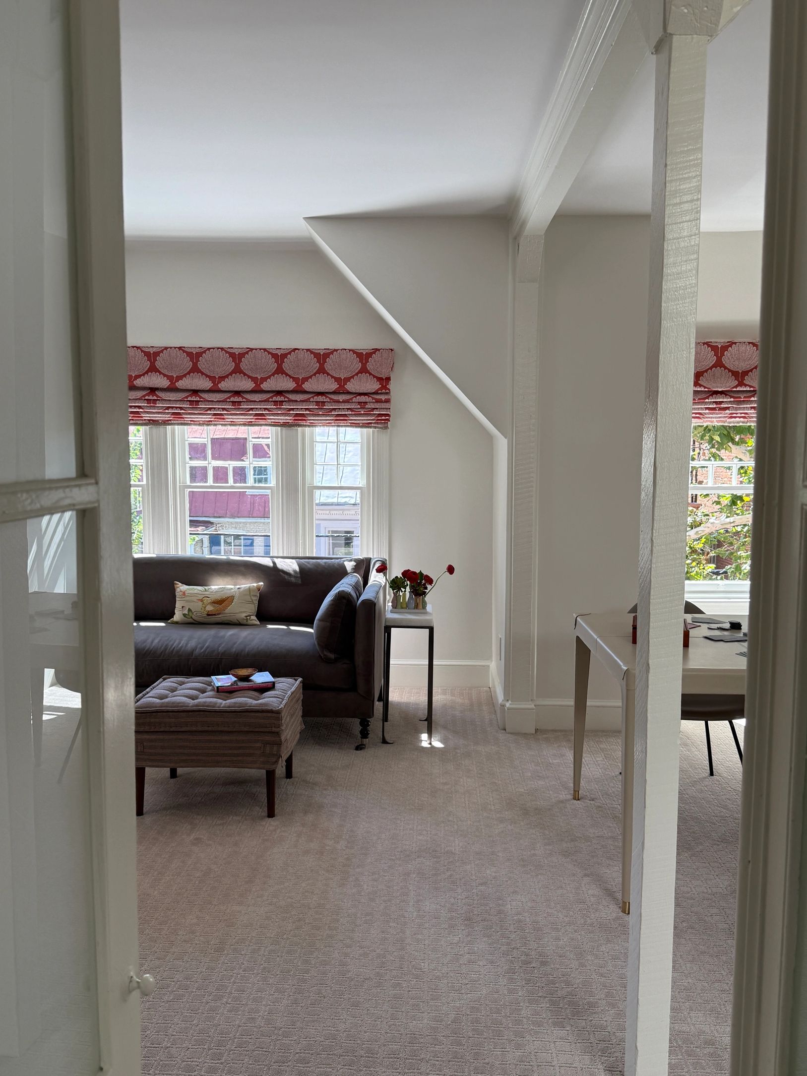 View into lounge room with sofa and game table