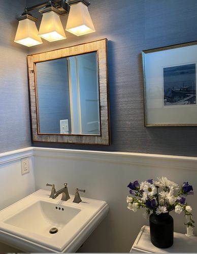 Bathroom with grasscloth wallpaper and bone inlay mirror