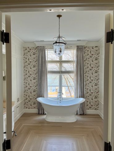 Large freestanding soaker tub in primary bath