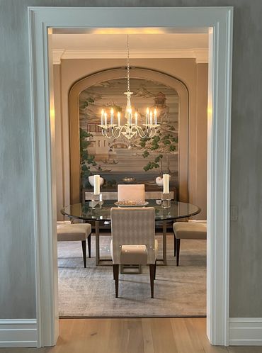 Dining room with bespoke painting and chandelier