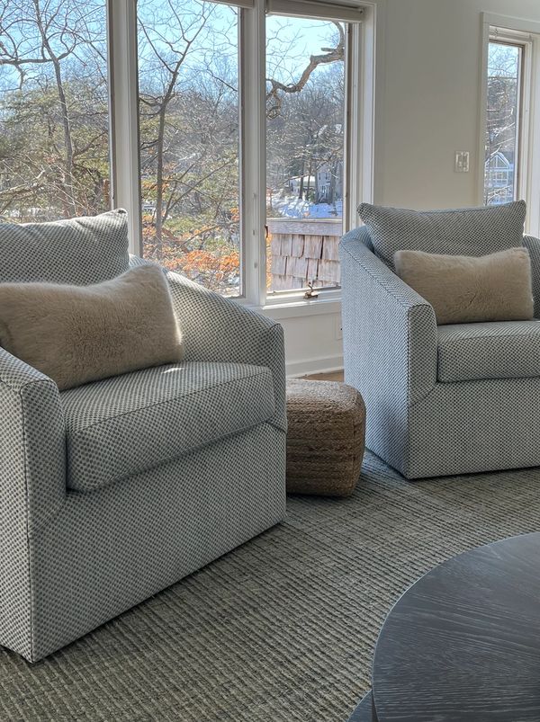 Swivel chairs with view of water behind them