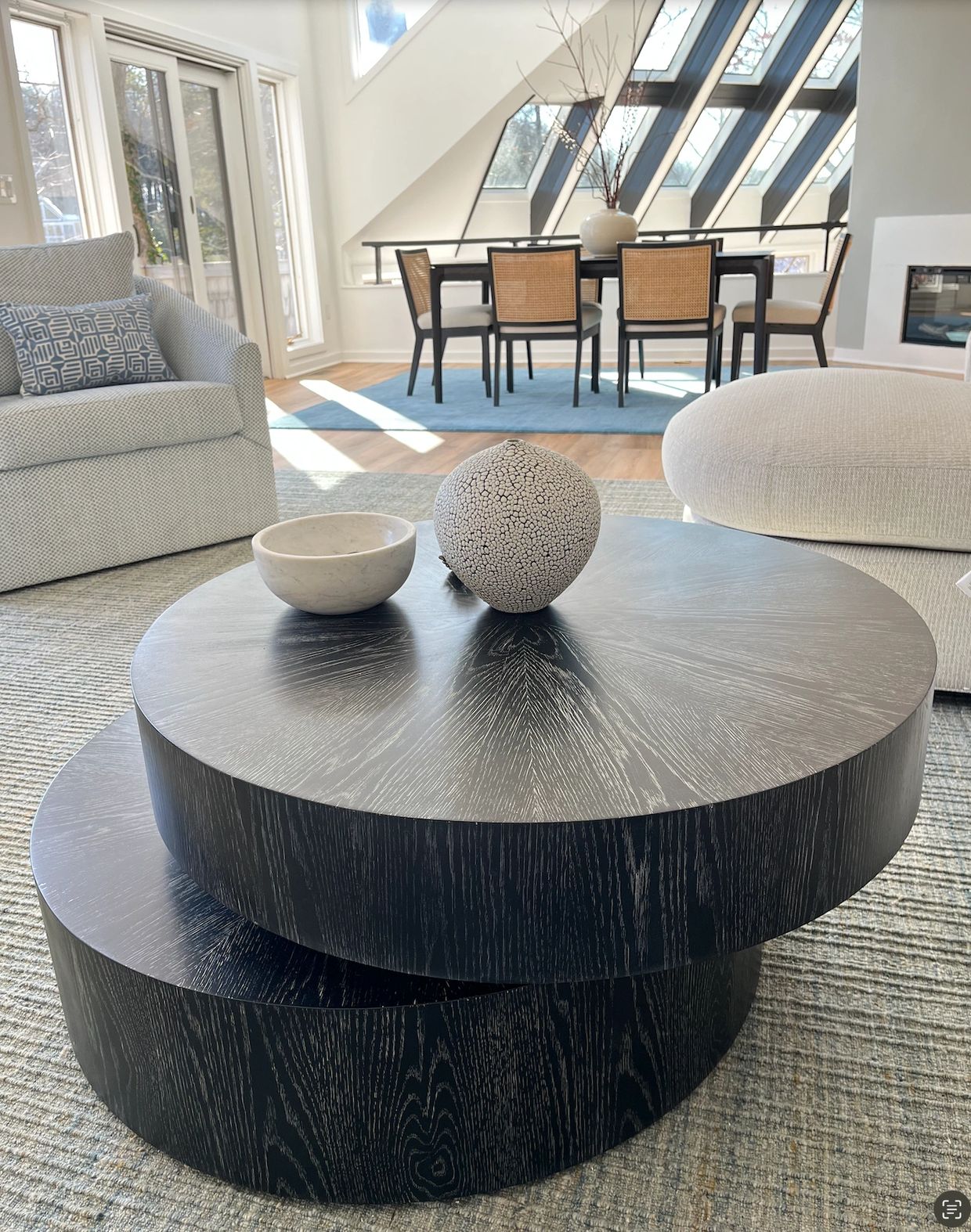 Close up of coffee table with light streaming in from large windows