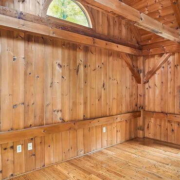 Lots of wood on the walls, floor and ceiling create a design challenge