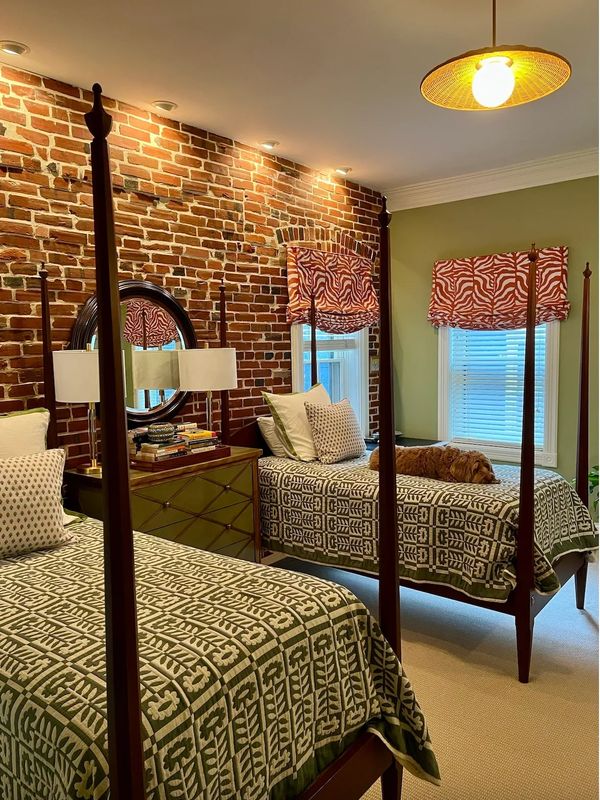 Bedroom with twin beds and roman shades