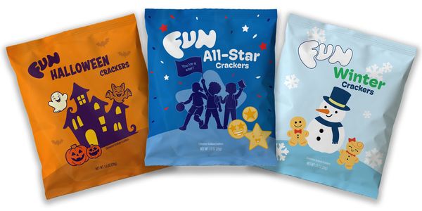 Three colorful packets of themed crackers with Halloween, All-Star, and Winter designs.