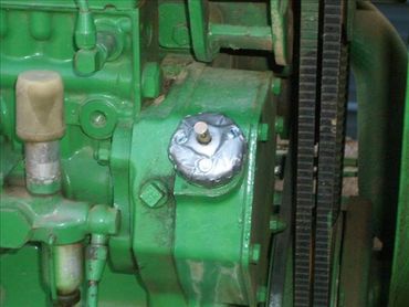 An attached fuel cap lock