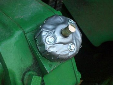 An attached oil cap lock