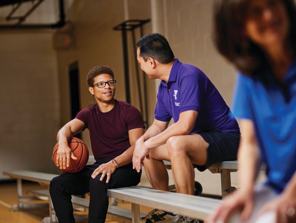 ymca photo of adults playing basketball