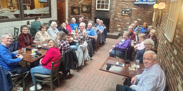 An image of our seniors eating lunch as a community.