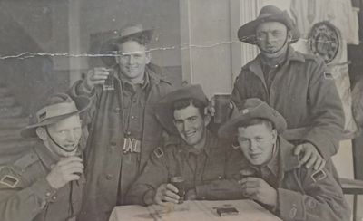 Frank Shelley NX39009 (centre) having a drink or two with his mates in the Middle East (Palestine) 1