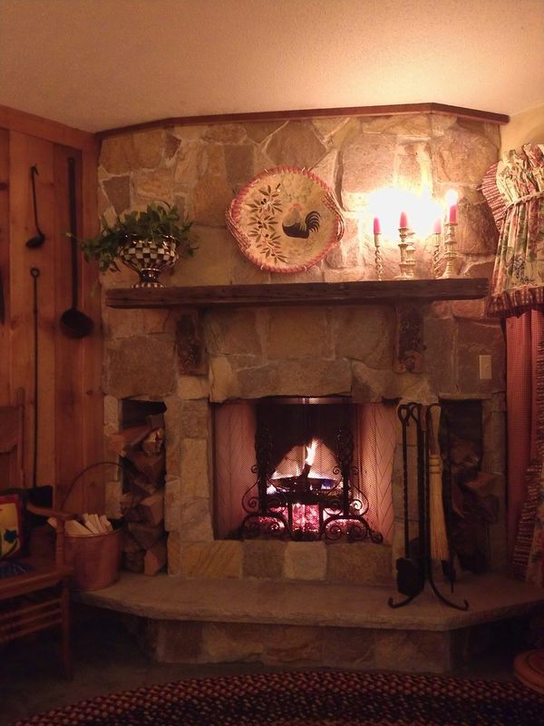 A gorgeous fireplace makeover using oxen yokes and an old beam for the mantel.