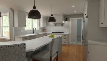 Modern kitchen with white cabinets, wooden floor, and gray upholstered chairs.