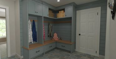 Cozy blue-painted mudroom with wooden bench and storage cabinets.