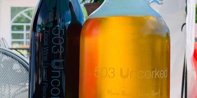 Take the taste of 503 Uncorked home with our great growlers