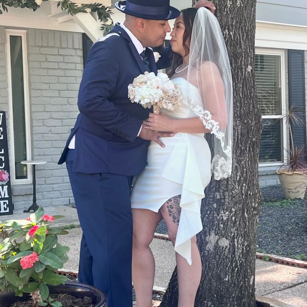 Couple sharing a tender moment on their wedding day.