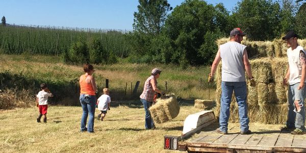 Family hauling hay