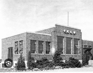 Black and white photo of a brick building with CKLW sign.