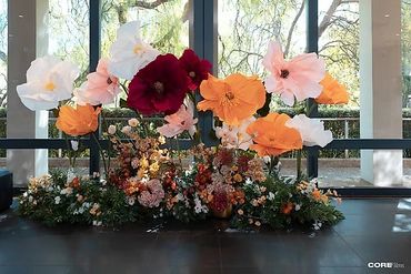 Fairyland dream with elegant event decor featuring giant fresh floral installations, whimsical detai