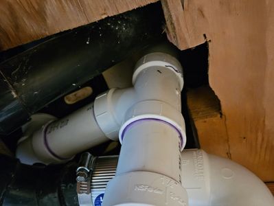 New tub drain from underneath with piping going up through the subfloor