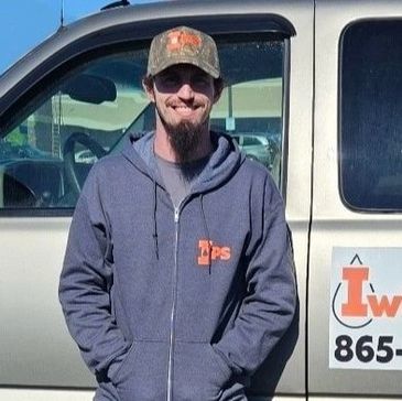 Iwicki Plumbing owner standing by work truck – Experienced plumber serving Jacksboro, TN