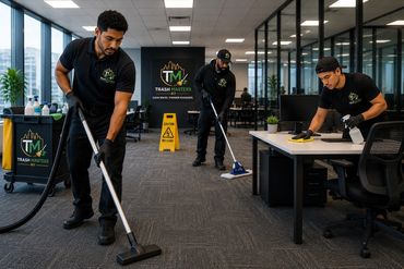 Trash Masters NY commercial cleaning team sanitizing and maintaining a modern office workspace.