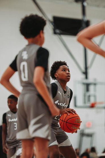 Young basketball player preparing to shoot during a game.