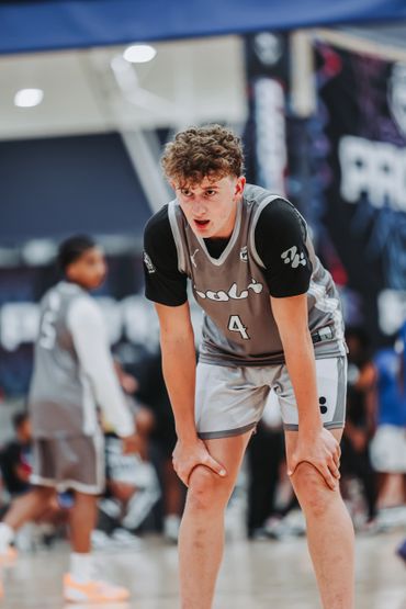 Young basketball player catching his breath during the game.