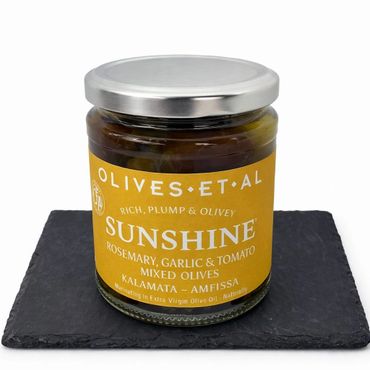 Jar of mixed Kalamata and Amfissa olives with rosemary, garlic, and tomato.