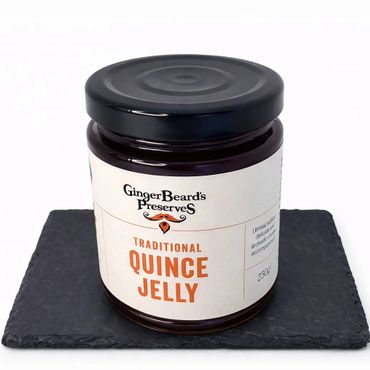 Jar of GingerBeard's Traditional Quince Jelly on a black slate.